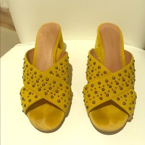 Suede chunky heels with metallic studs.